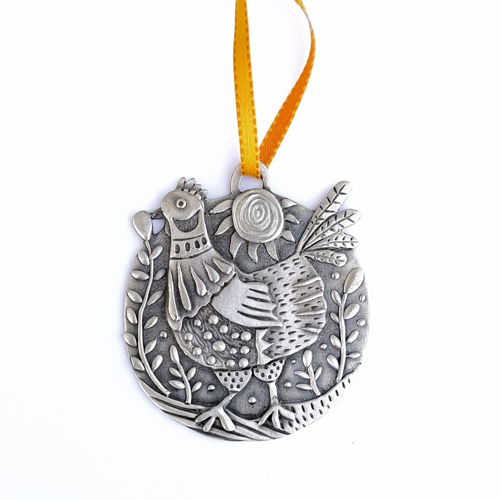 Chicken Little pewter ornament by Leandra Drumm, white background
