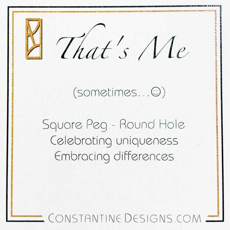 Product tag for That's Me sterling silver and 14 karat gold pendant by Lynda Constantine.