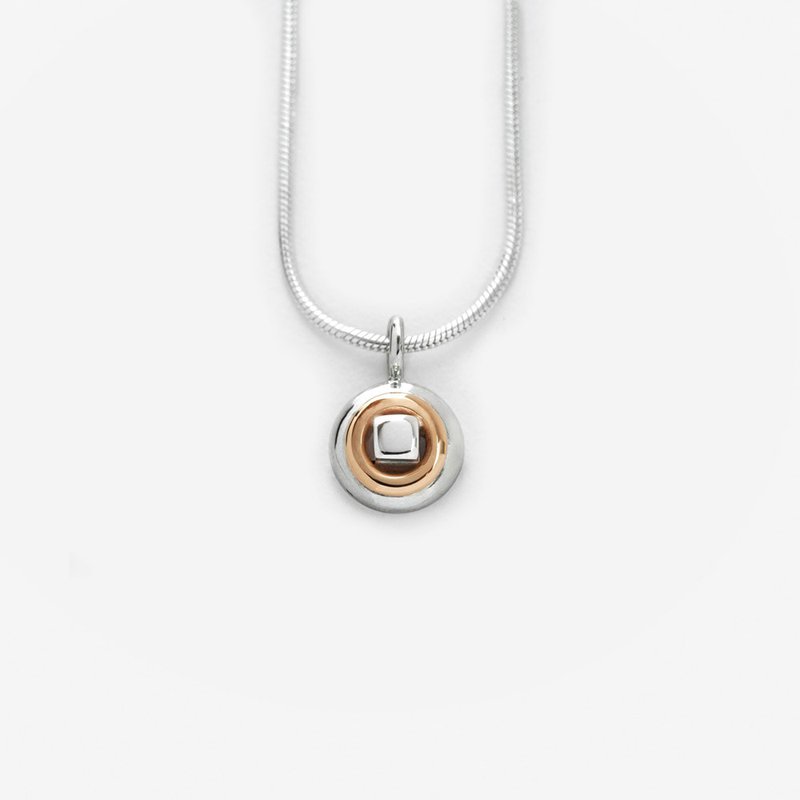 Sterling silver with 14 karat gold pendant drop, "That's Me" representing a square peg in a round hole.