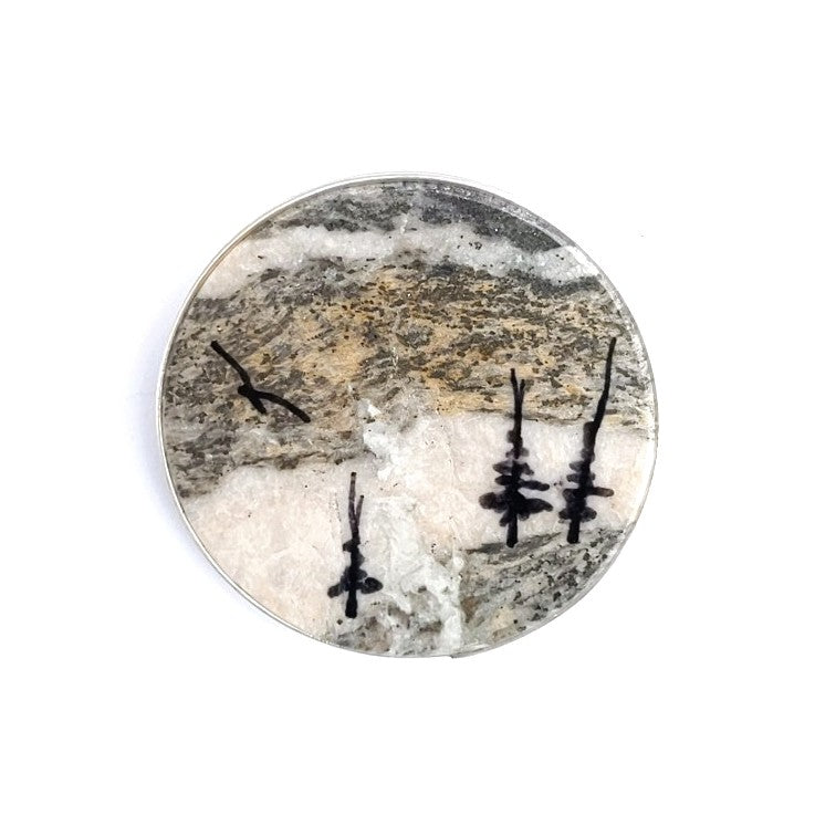 Brooch made with a slice of stone, hand painted by Wendy Stanwick of A Slice of the North jewellery.