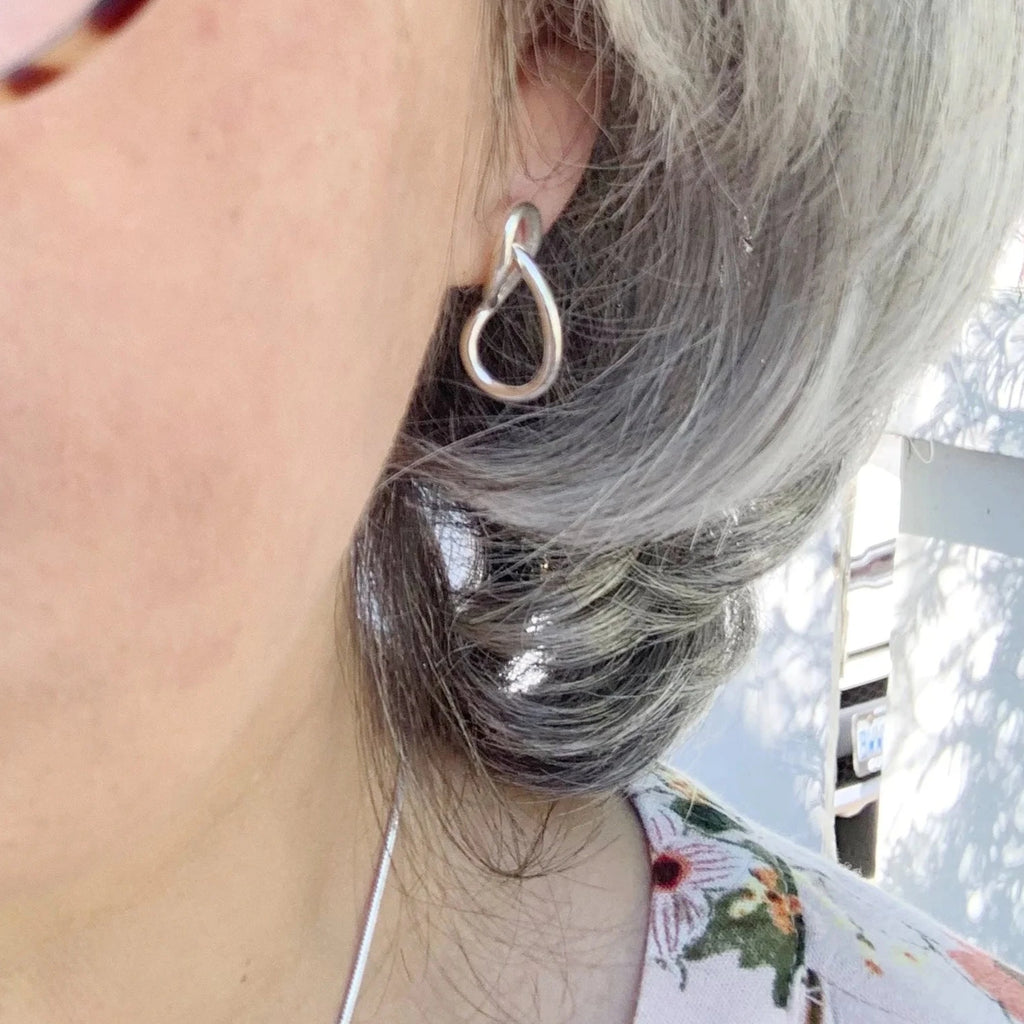 Lifestyle view of Sterling silver Simplicity earrings, handcrafted by Lynda Constantine, made in Canada
