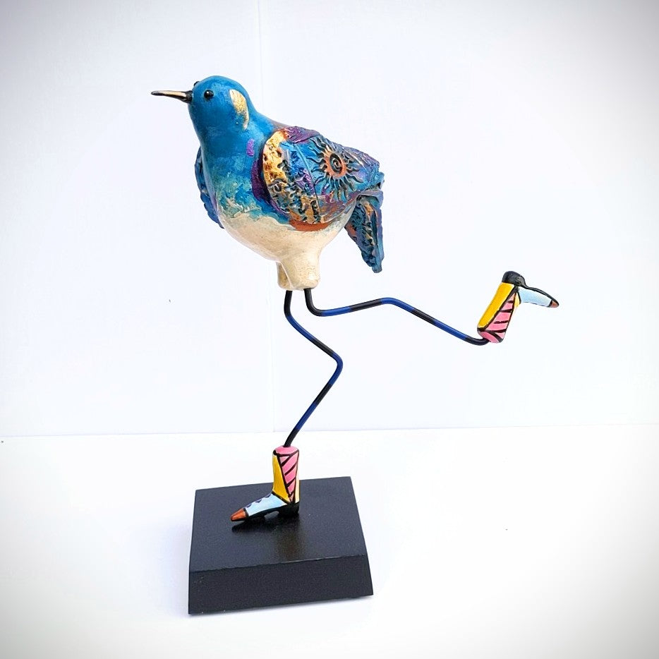 Lon legged Bird with cowboy boots, ceramic sculpture by Steven  McGovney