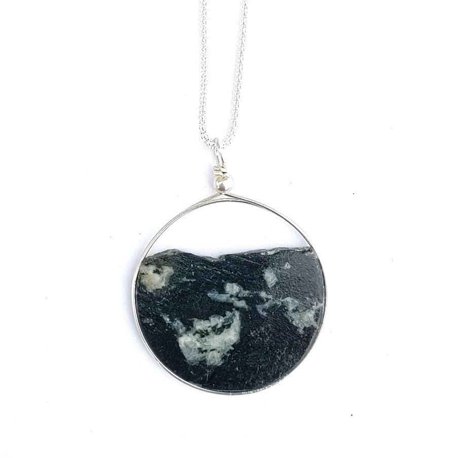 A thin slice of solid rock makes up this pendant, created by Wendy Stanwick of A Slice of the North Jewellery.