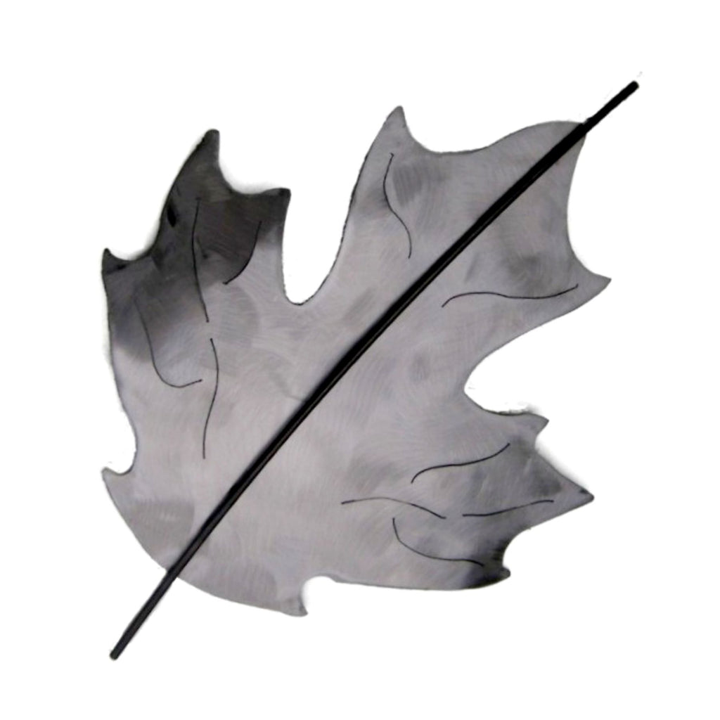 Shiny steel Maple Leaf, slightly coved to create space from the wall, handcrafted metal wall  art by Metallic Evolution.