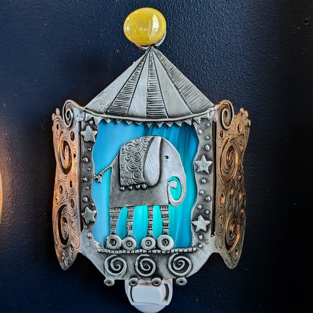 Circus Pewter night light by Leandra Drumm,  image with light on.