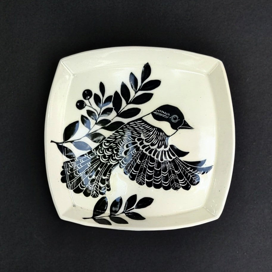 Square rimmed plate, bird design carved on white clay, pottery by Amanda Kerr