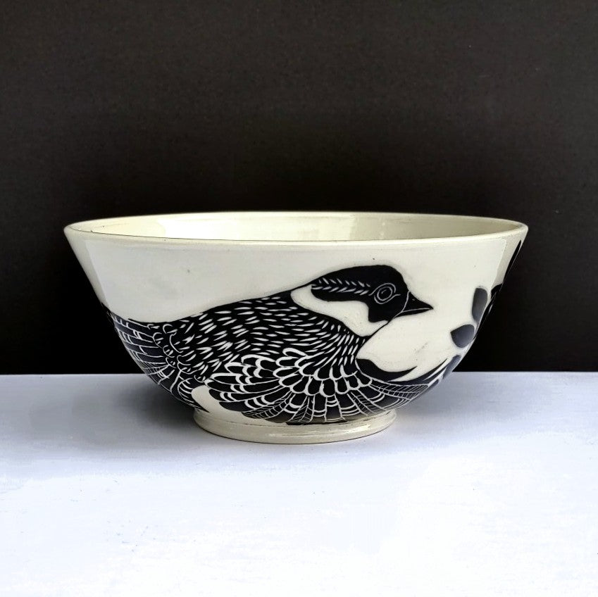 Side view of bird - White clay with black carved design, pottery bowl by Amanda Kerr