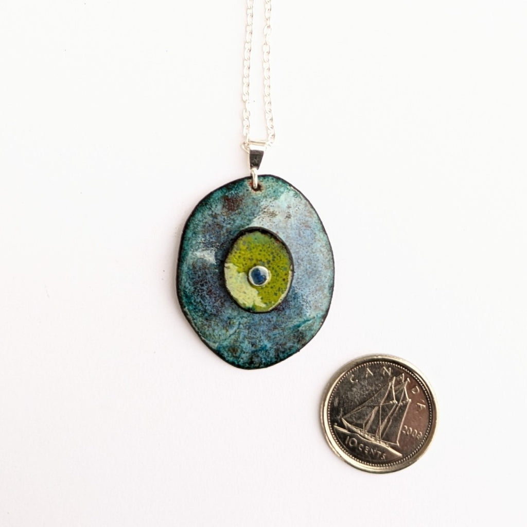 scale view of Domed enamel pendant with layers, by Canadian artisan Timothy Laurin.