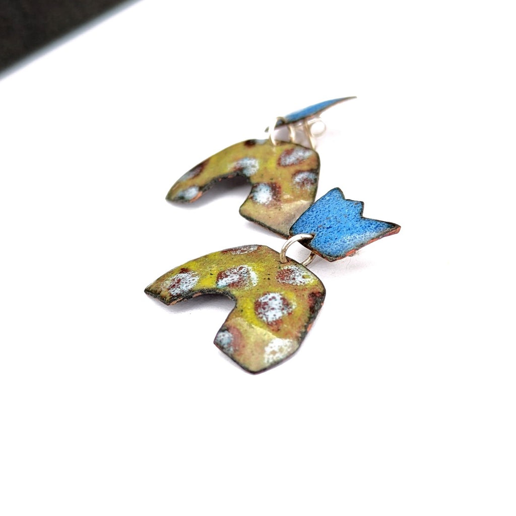 side view of A mini-crown, abstract enamel earring, handmade in Canada by Timothy Laurin
