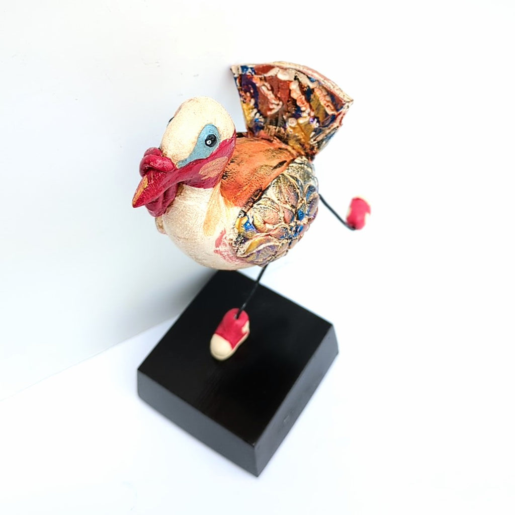 Decorative Turkey figurine with tennis shoes, on a solid base, ceramic sculpture handcrafted by Steven McGovney, top view