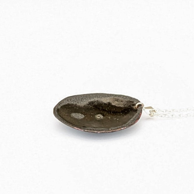 back view of domed enamel pendant
