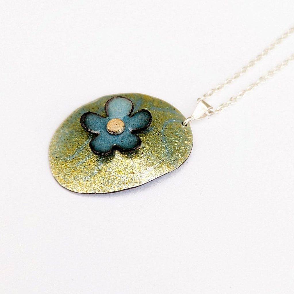 detail view of Floral domed pendant in enamel by Timothy Laurin, made in Canada