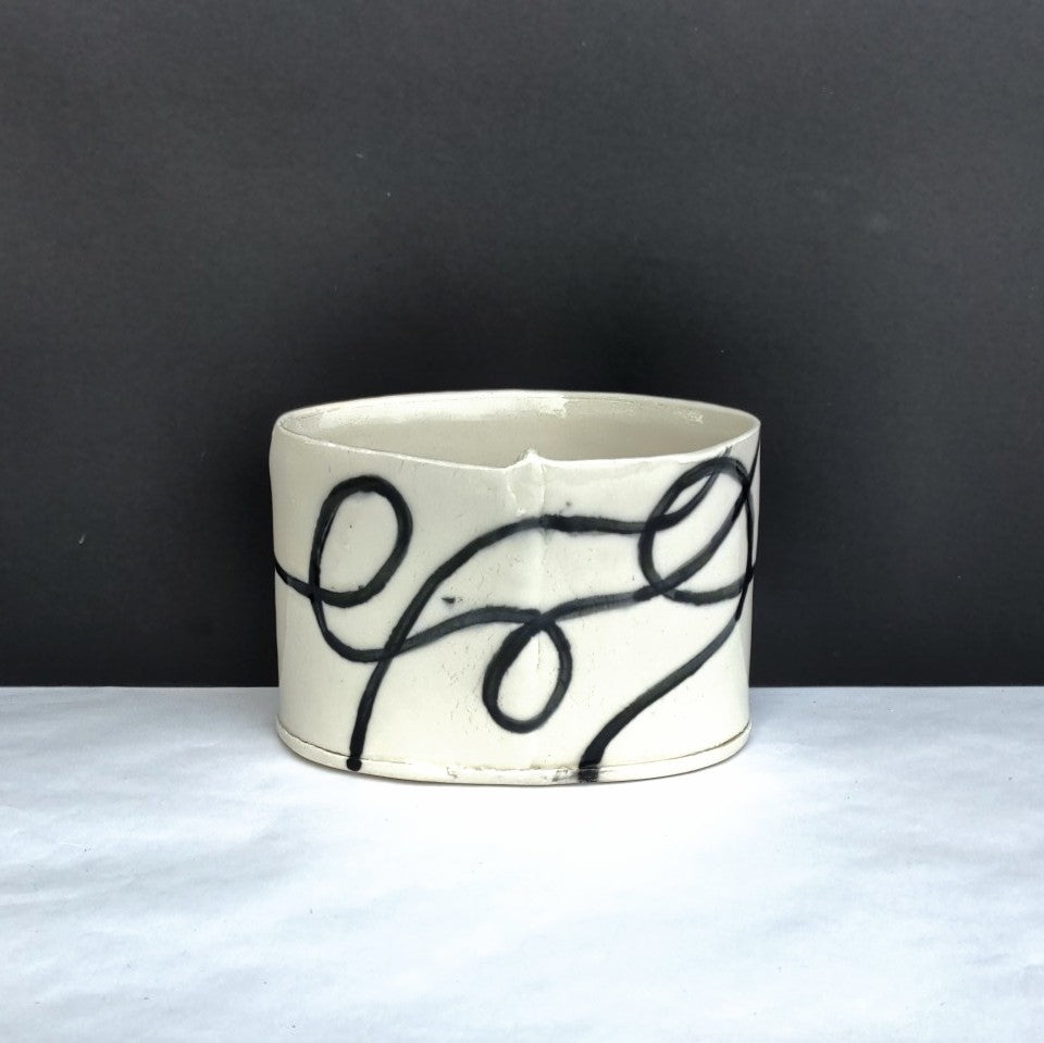 Oval vase, hand built in white clay by Juliet Promnitz, graphic design