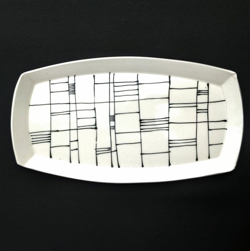 Gridwork design, black and white serving platter, hand made pottery by Juliet Promintz