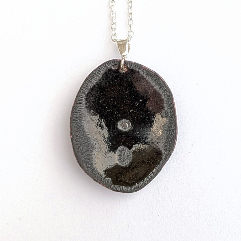 back view of Domed enamel pendant with layers, by Canadian artisan Timothy Laurin.