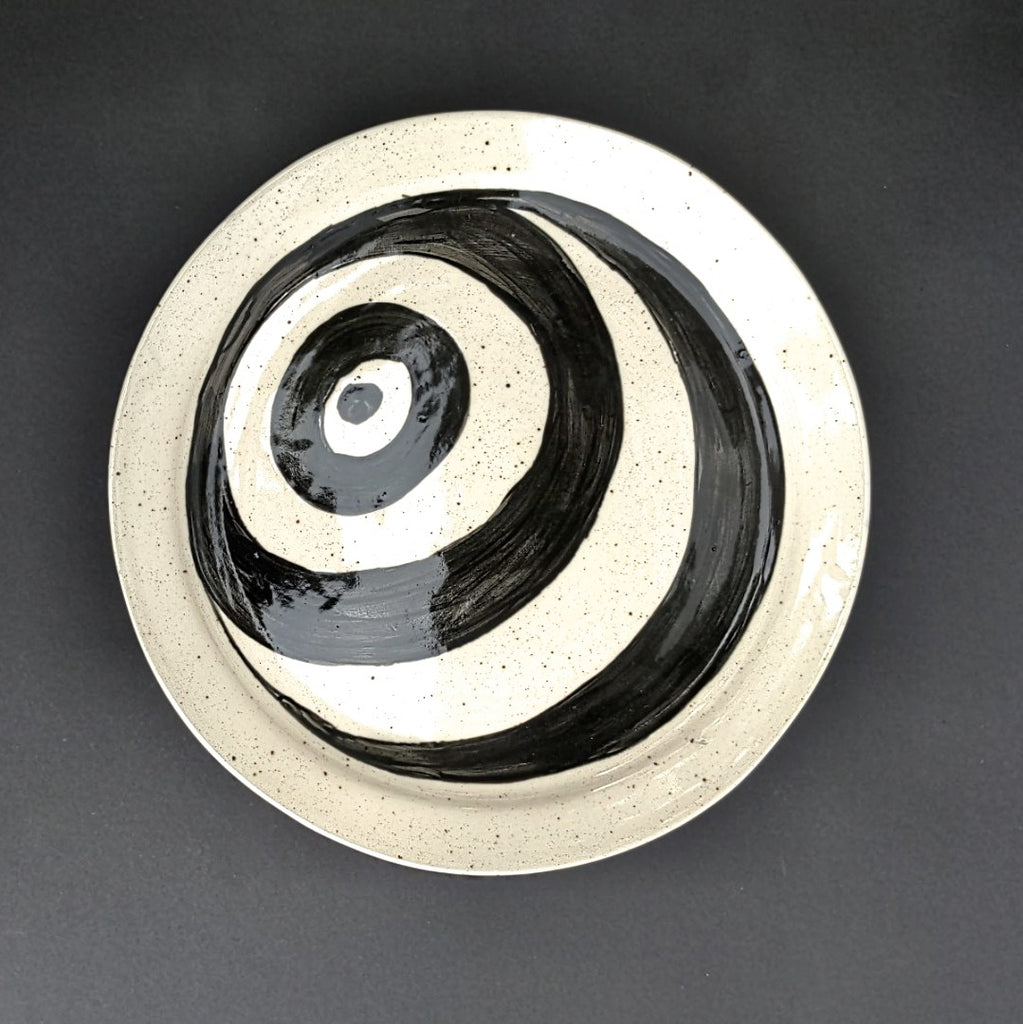 Top view of bold graphic hand built pottery plate by Juliet Promnitz