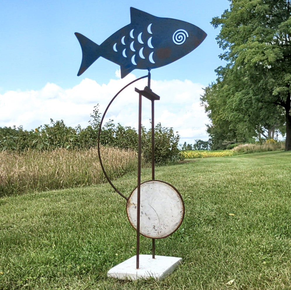 Outdoor view Kinetic sculpture by Mark Clark, steel and concrete 