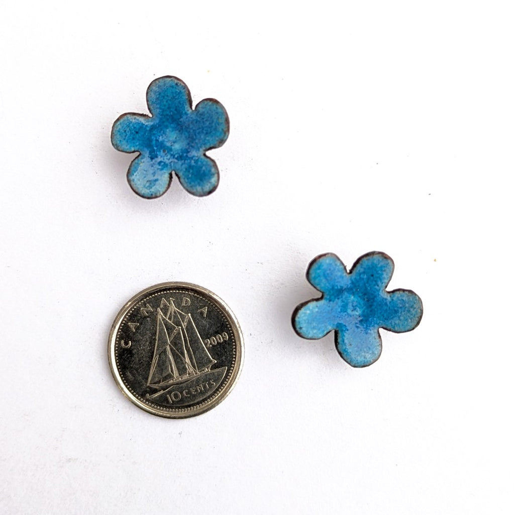 Blue enamel flower stud earrings by Timothy Laurin, handmade in Canada, showing actual size.