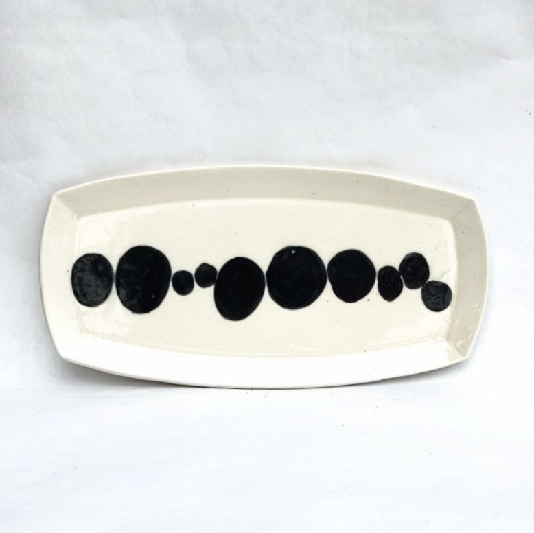 White clay platter with bold design by Juliet Promnitz, white background