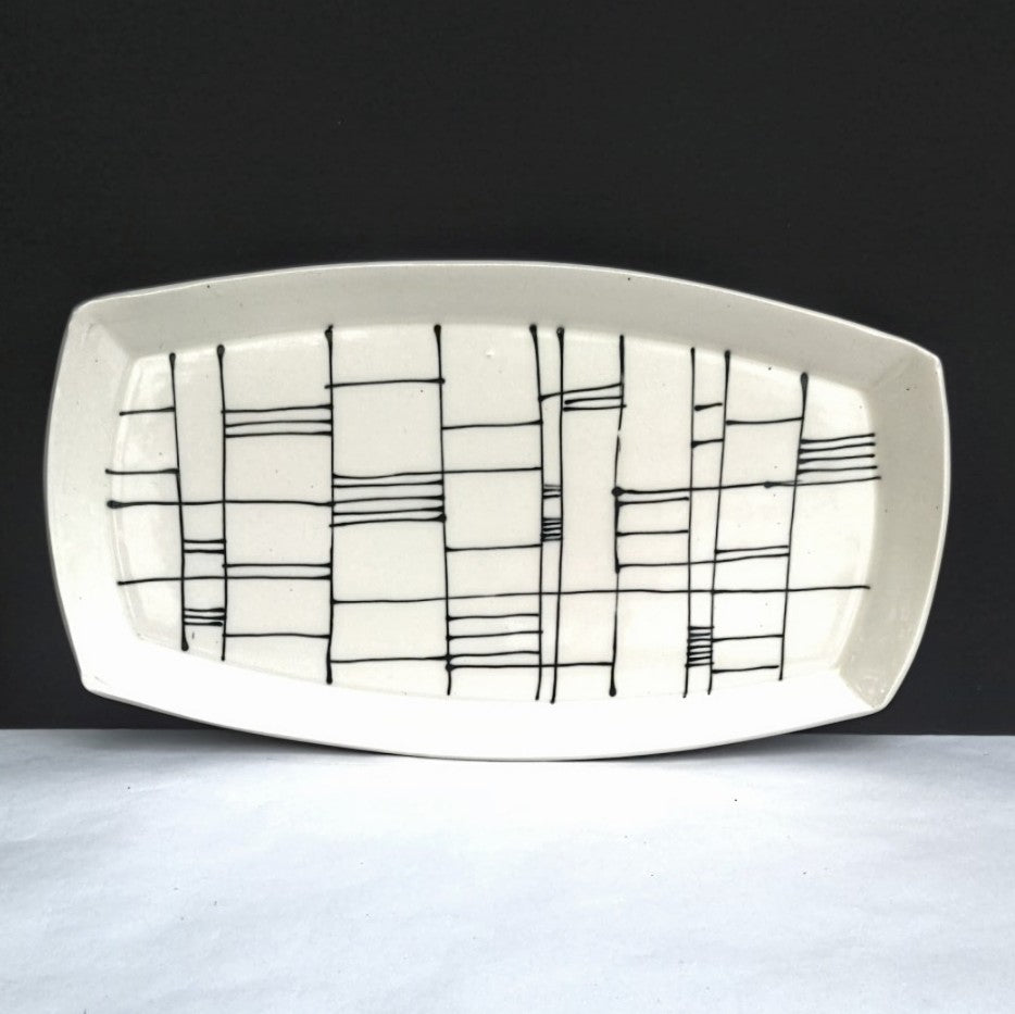 alternate view of Gridwork design, black and white serving platter, hand made pottery by Juliet Promintz