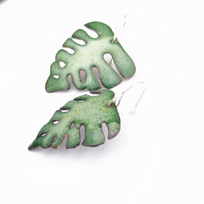 Leaf-shaped enamel earrings, made in Canada by Timothy Laurin, side view showing hammered shape.