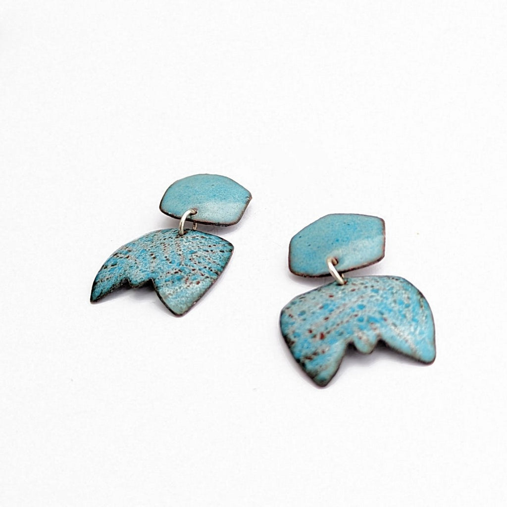 side view of Abstract dangle earring handcrafted by Timothy Laurin.  Blue speckled enamel earring