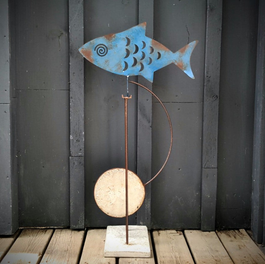 Blue fanciful fish Kinetic sculpture by Mark Clark, steel and concrete