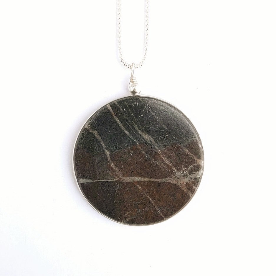 Back view of a thin slice of solid rock  pendant, created by Wendy Stanwick of A Slice of the North Jewellery.