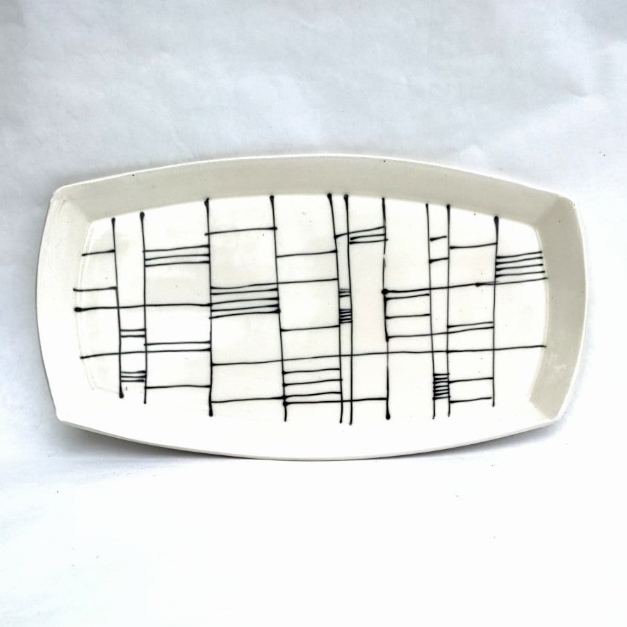 Top view of Gridwork design, black and white serving platter, hand made pottery by Juliet Promintz