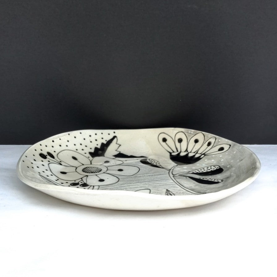 side view of One of a kind black and white designer plate by Juliet Promnitz