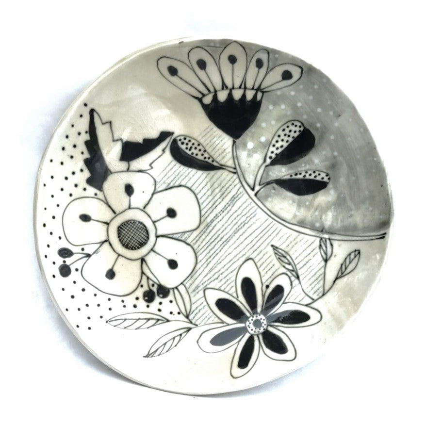 One of a kind black and white designer plate by Juliet Promnitz, white background