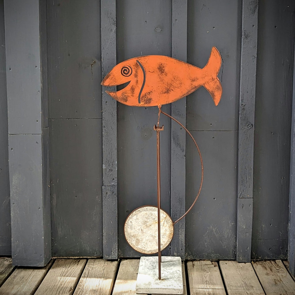 Orange fish Kinetic sculpture by Mark Clark, steel and concrete