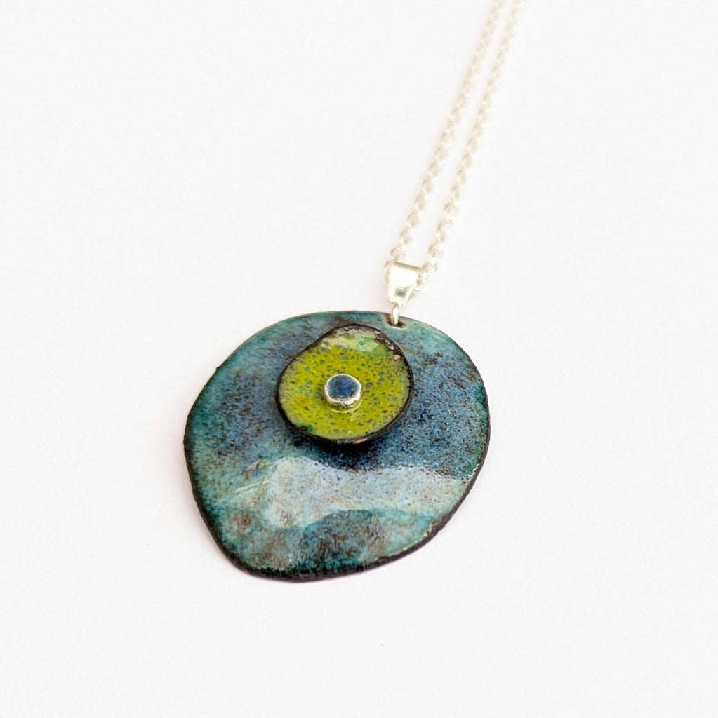 close up view of Domed enamel pendant with layers, by Canadian artisan Timothy Laurin.