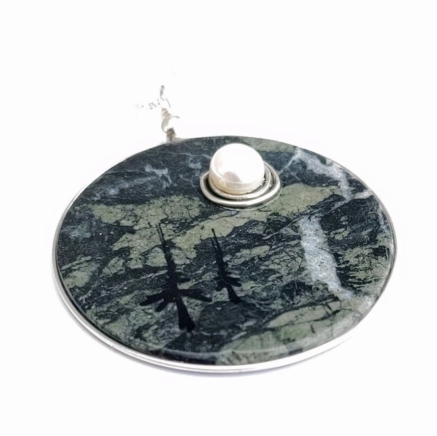 Solid Granite disc, painted northern trees, freshwater pearl, sterling silver chain, pendant by Wendy Stanwick, A Slice of the North jewellery. detail shot