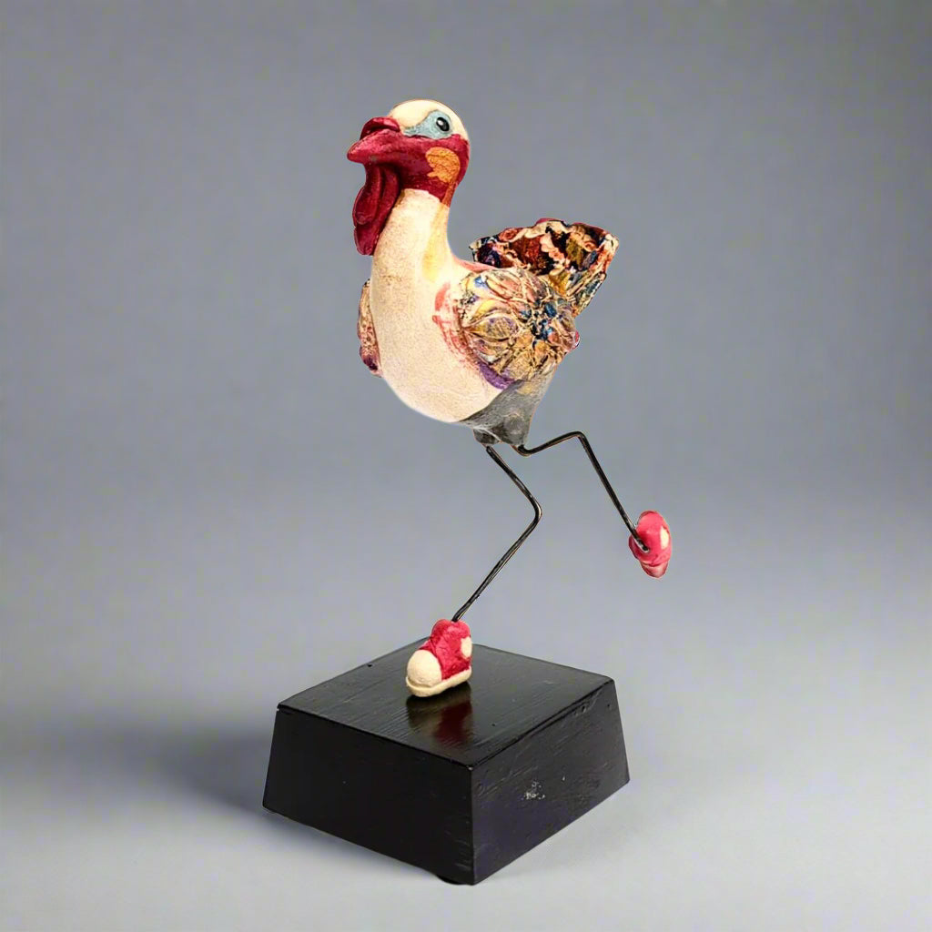 Ceramic Turkey figurine with tennis shoes, on a solid base, sculpture handcrafted by Steven McGovney.