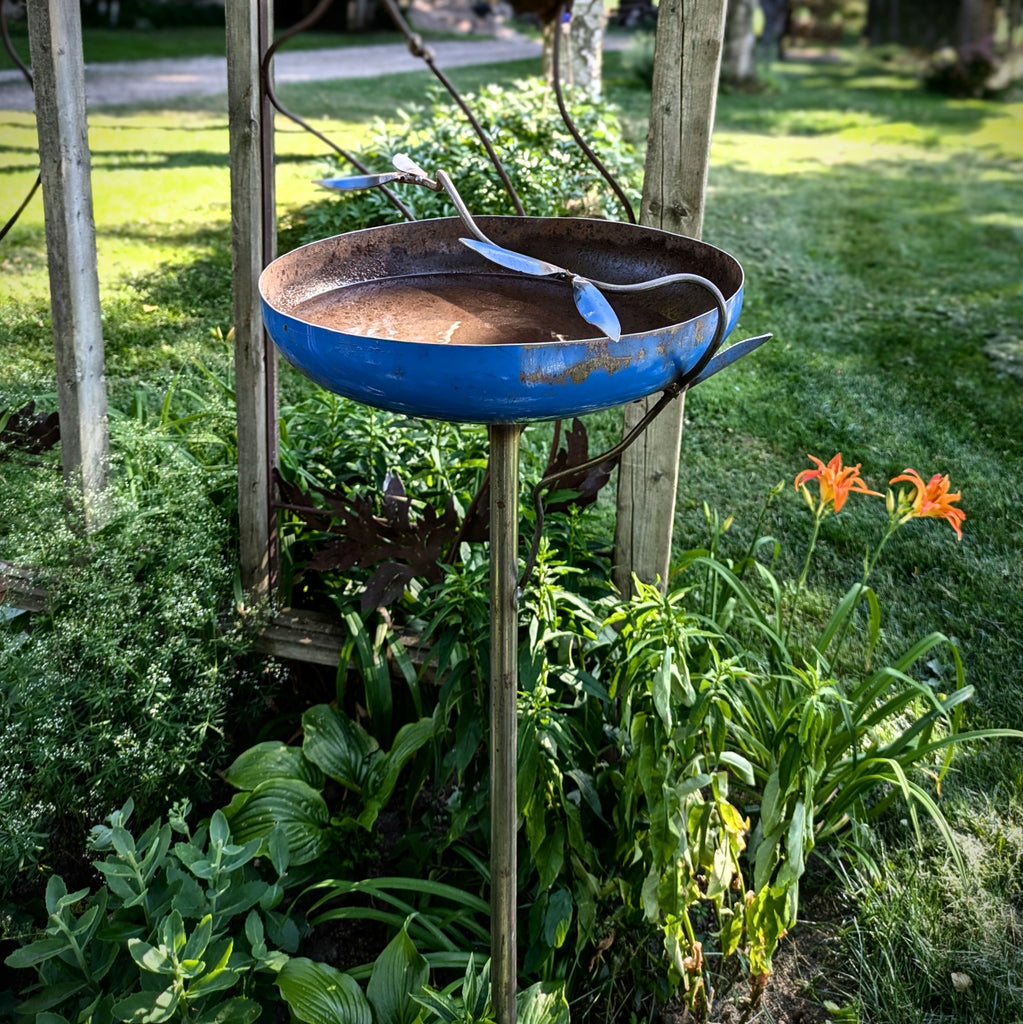 Recycled metal bird bath with metal branch by Metallic Evolution, made in Canada, available at Styll.