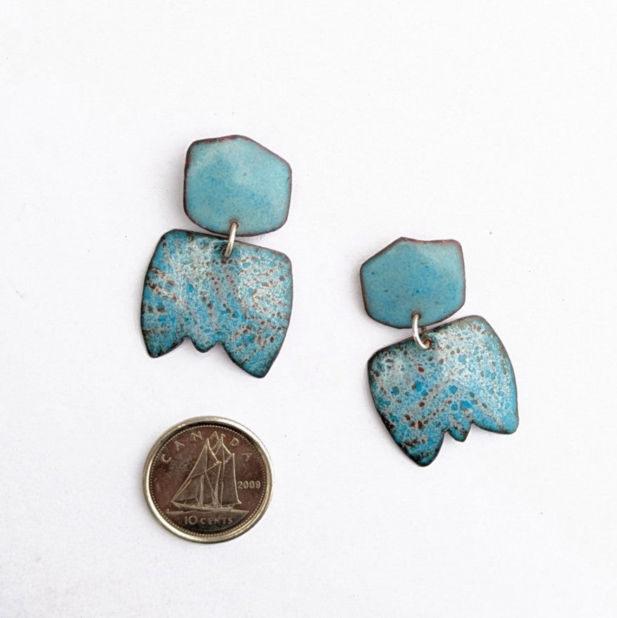 scale view of Abstract dangle earring handcrafted by Timothy Laurin.  Blue speckled enamel earring
