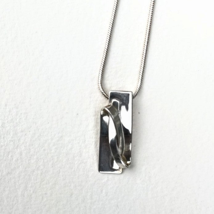 Front view Ribbon Pendant, sterling silver on snake chain by Lynda Constantine, made in Canada