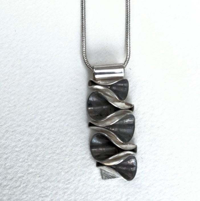 Ruffles sterling silver pendant, with oxidized detailing, handcrafted by Lynda Constantine.
