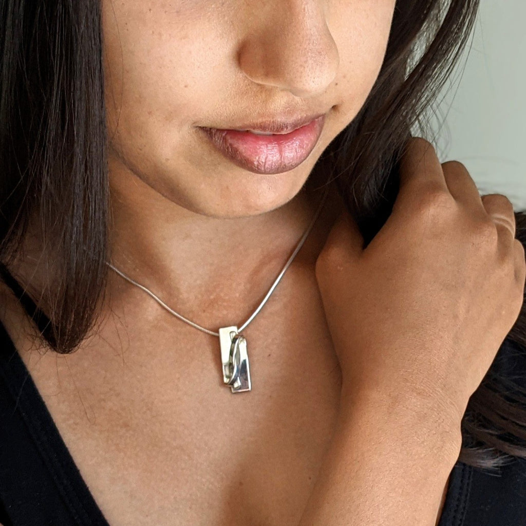 Alternative view of Ribbon Pendant, sterling silver on snake chain by Lynda Constantine, made in Canada