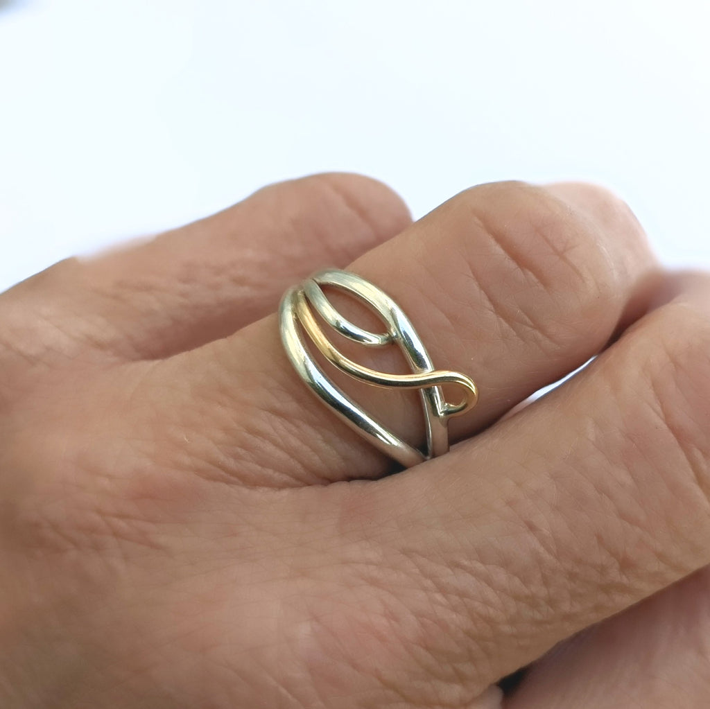 Lifestyle view of Flame ring in sterling silver and 14 karat gold, handcrafted in Canada by Lynda Constantine