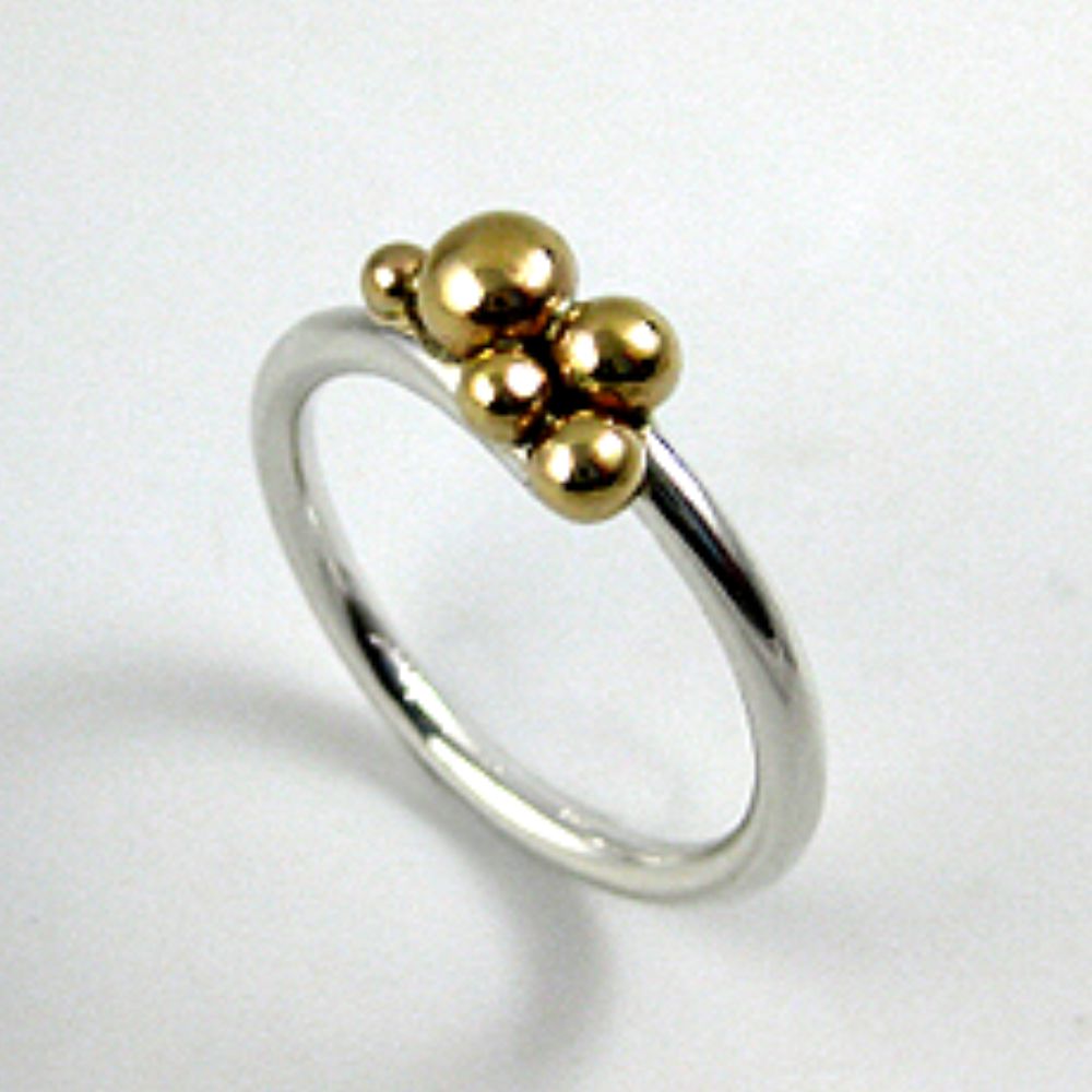 Sterling silver ring band with 14 karat gold dotted accents, handcrafted jewellery by Constantine Designs, made in Canada