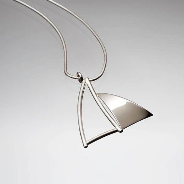 Side view of Handcrafted sterling silver Sail Pendant by Lynda Constantine, made in Canada